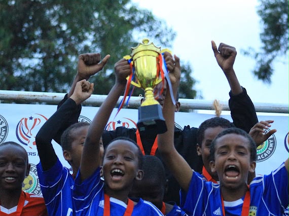 Rangers junior players lifting a trophy and celebrating